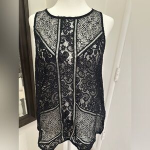 Express women’s top. Perfect addition. Never warm but washed ones. Size medium.